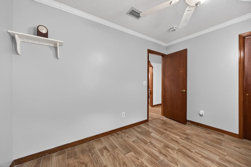 Empty room with wood flooring and doorway at 981 Marble Ridge Dr, Orange Park, FL 32065