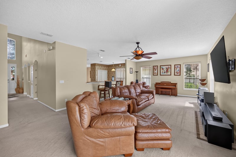 Family room with leather sectional at 2875 Pebblewood Ln, Orange Park, FL 32065