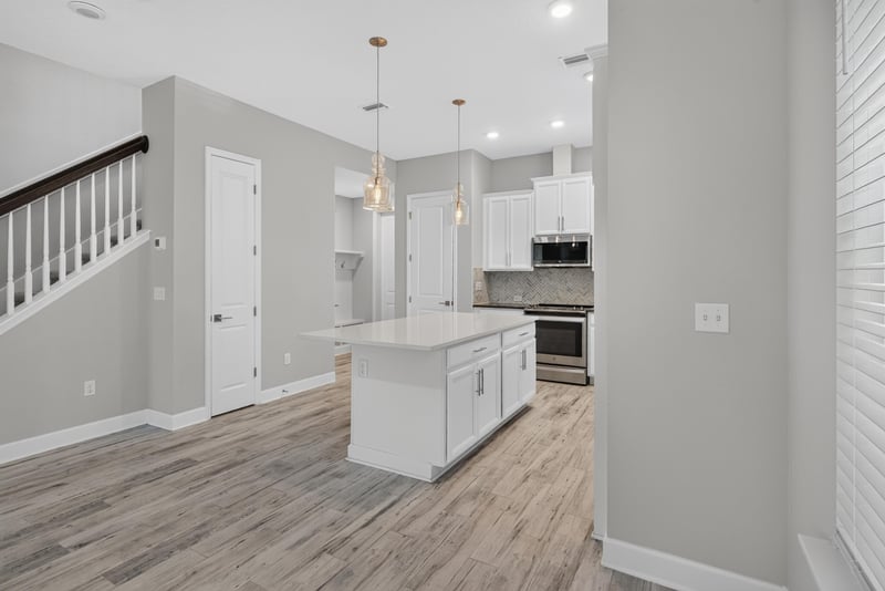 Kitchen island and staircase railing at 7446 Loggerhead Ct, Jacksonville, FL 32256