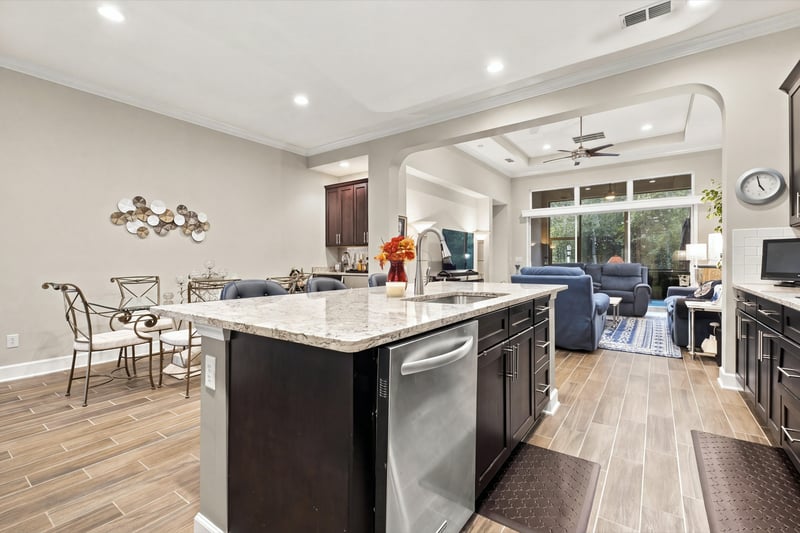 Kitchen and living area from dining side, photographed by Megapixeler on Lucena Ln, Jacksonville, FL