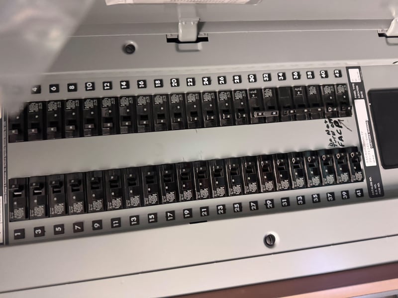 Full breaker panel with labeled switches at 11700 New Kings Rd, Jacksonville, FL 32219
