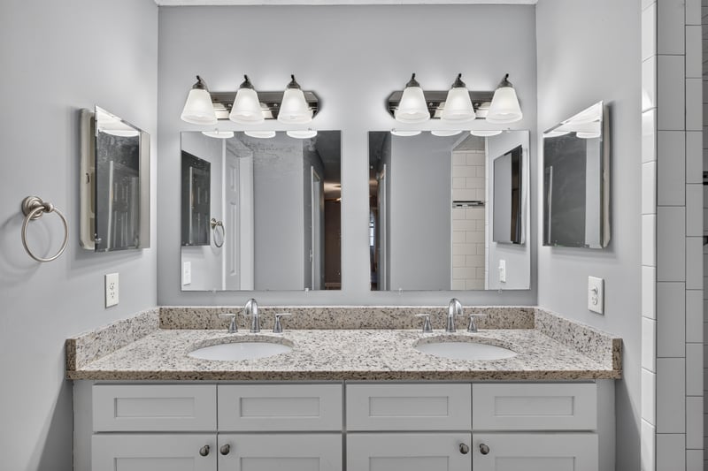 Bathroom with double vanity and mirrors at 12344 Cormorant Ct, Jacksonville, FL