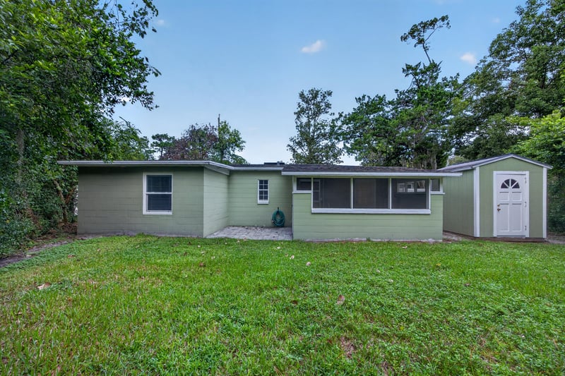 Backyard, green house exterior and storage shed at 2256 Inwood Cir S, Jacksonville, FL