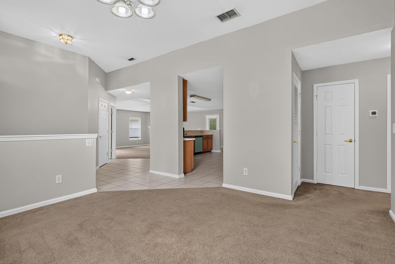 Hallway view toward the kitchen at 11669 Collins Creek Dr, Jacksonville, FL 32258