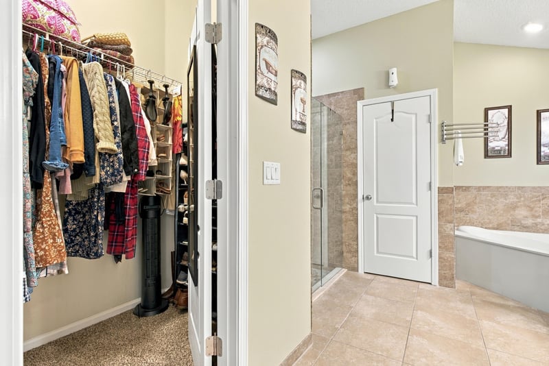 Walk-in closet with clothes racks at 10923 Black Diamond Ct, Jacksonville, FL