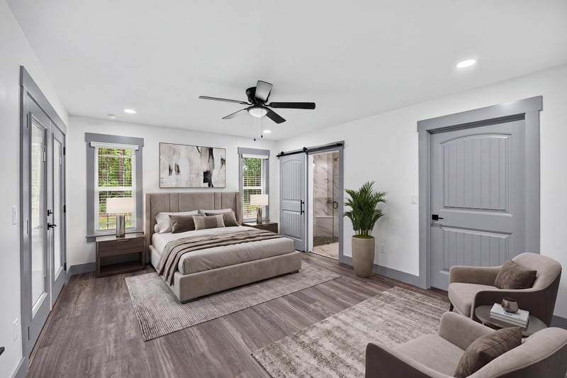 Primary bedroom staged with bed and armchair at 4800 Acacia St, Middleburg, FL 32068