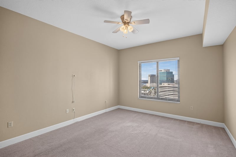 Bedroom with ceiling fan and downtown view at 1478 Riverplace Blvd 1904, Jacksonville, FL 32207