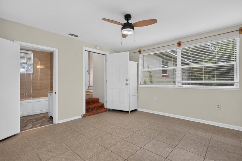 Room with tile floor, window and doorway at 217 Baisden Rd, Jacksonville, FL 32218