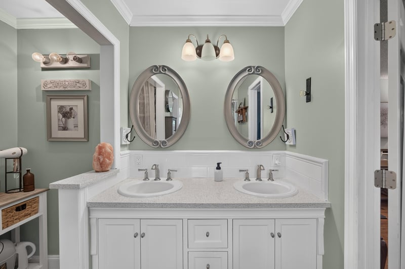Dual vanity bathroom with round mirrors at 4556 Shaky Leaf Ln N, Jacksonville, FL 32224
