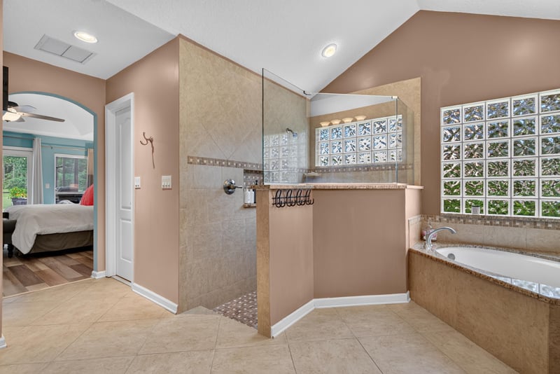Bathroom with walk-in shower and glass block window at 2304 Spring Hill Ct, Orange Park, FL