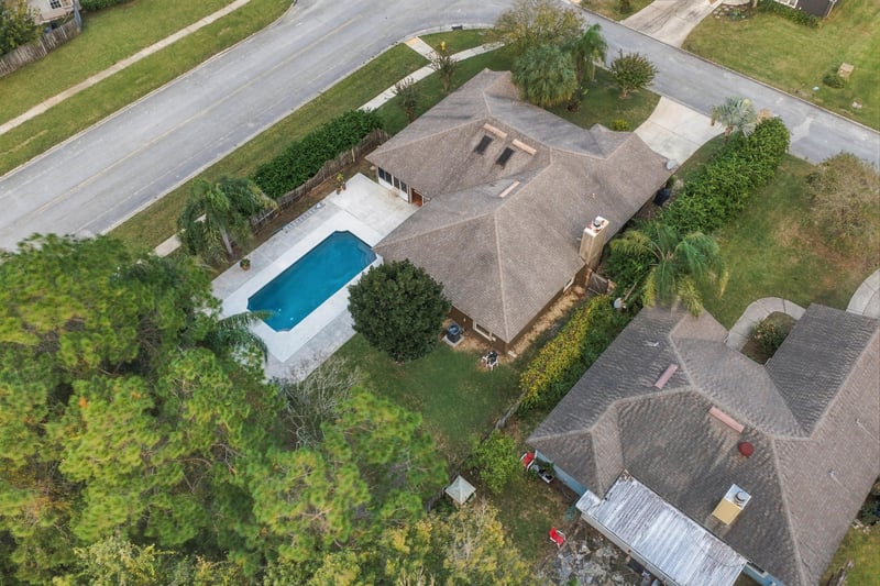 Aerial view of the home and pool, photographed by Megapixeler on Winding Springs Ct, Jacksonville