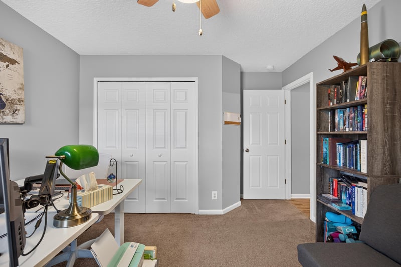 Bedroom used as office with desk and bookshelf at 12825 Kelsey Island Dr, Jacksonville, FL 32224
