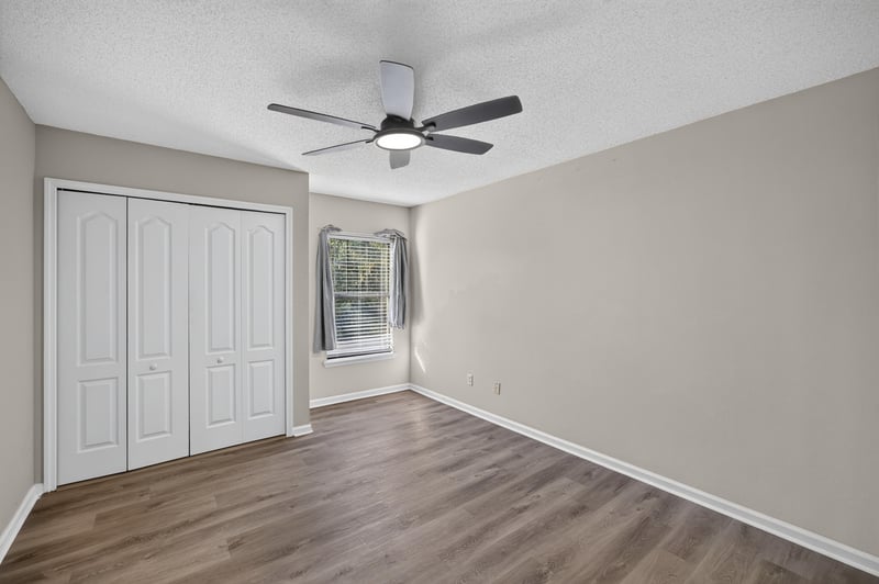 Empty bedroom with closet and window at 7723 Playschool Ln, Jacksonville, FL