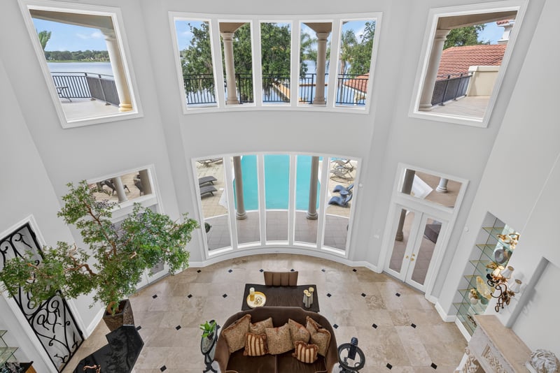 Upstairs loft with two-story windows and pool view at 344 Broward Rd, Jacksonville, FL