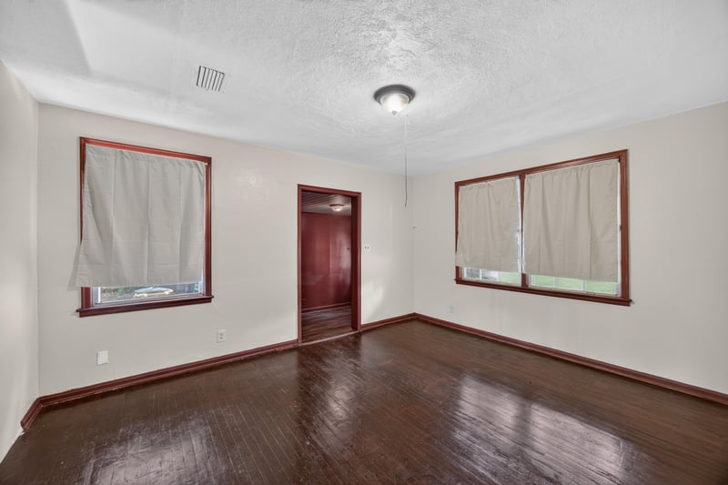 Empty room with red trim doors and windows at 2132 Allandale Cir W, Jacksonville, FL