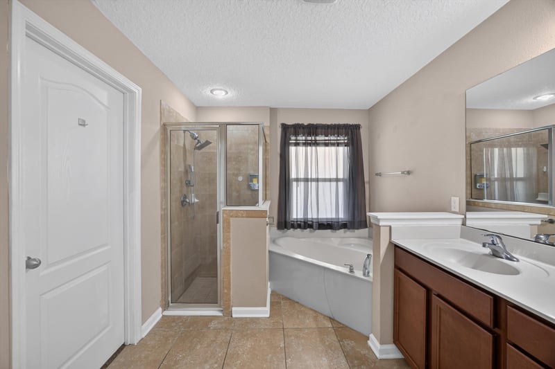Bathroom with walk-in shower and tub at 469 Glendale Ln, Orange Park, FL