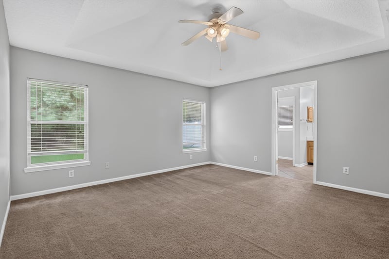 Empty carpeted room with window at 11669 Collins Creek Dr, Jacksonville, FL 32258