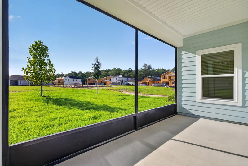 Screened lanai with view of neighboring homes at 269 Bluegrass Wy, St. Augustine, FL 32092