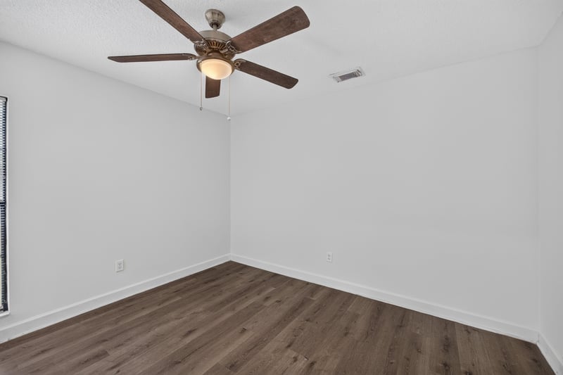 Bedroom with ceiling fan and wood floor at 551 Deltona Blvd, St. Augustine, FL 32086