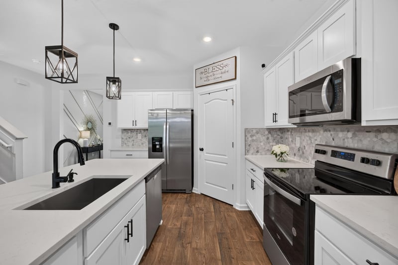Kitchen sink and stainless refrigerator at 65255 Frst Glen Ln, Yulee, FL 32097