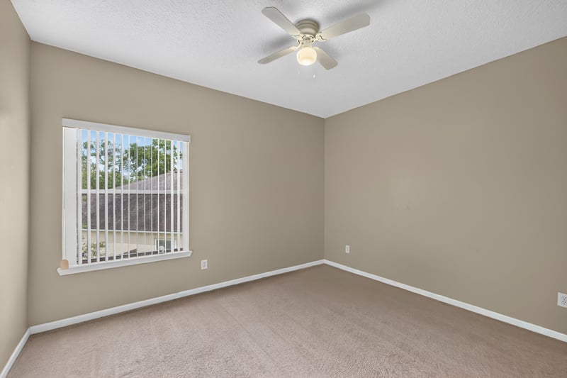 Empty bedroom with window at 2875 Pebblewood Ln, Orange Park, FL 32065