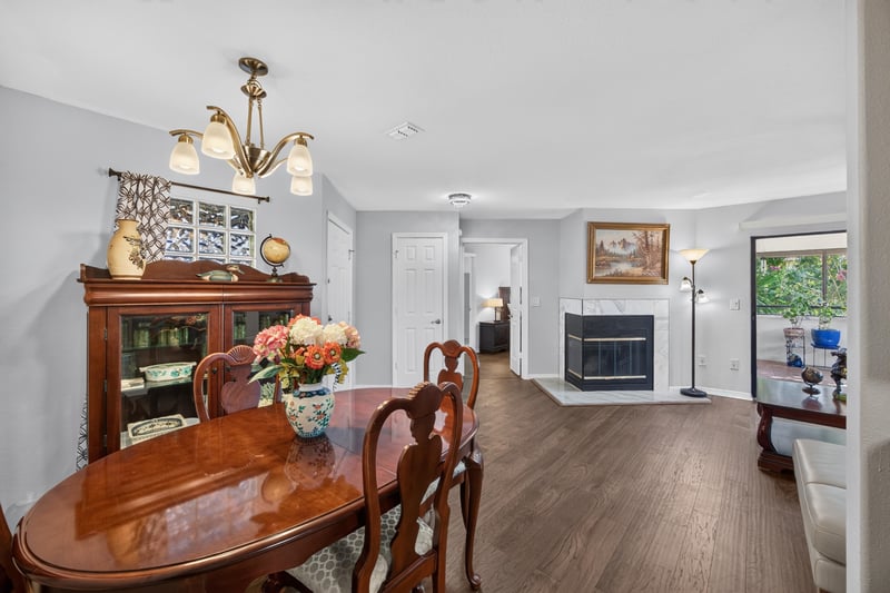 Dining room with table, hutch, and fireplace at 10150 Belle Rive Blvd, Jacksonville, FL