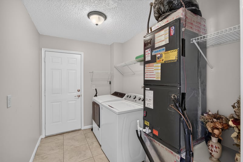 Laundry area with washer and dryer at 11828 Heather Grove Ln, Jacksonville, FL