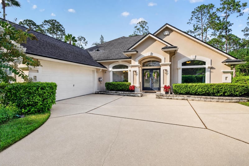 Front entry and garage with circular driveway at 2304 Spring Hill Ct, Orange Park, FL