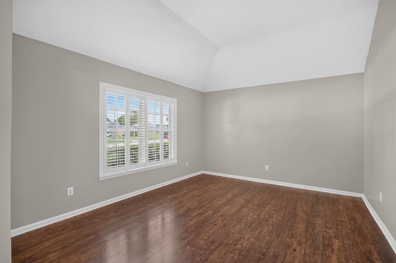 Empty living room with wood floor and window at 1955 GUARDED Way, Fleming Island, FL 32003
