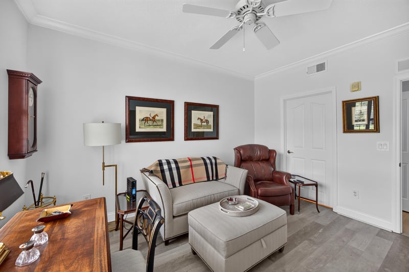 Sitting room with leather chairs and ottoman at 10435 Mid Town Pkwy unit 135, Jacksonville, FL 32246