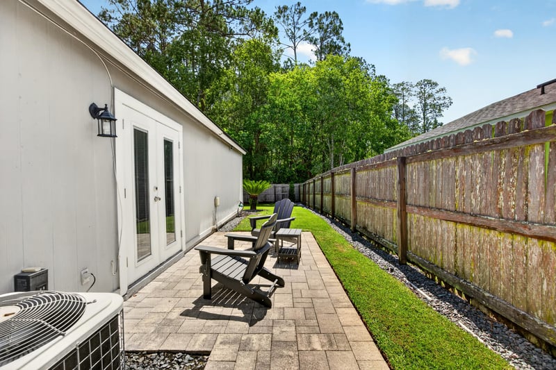 Garage with wall shelving and storage at 3067 Wavering Ln, Middleburg, FL 32068
