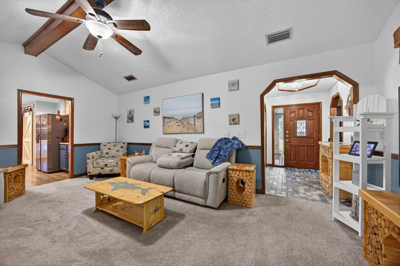 Living room view toward entry with ceiling fan at 981 Marble Ridge Dr, Orange Park, FL 32065