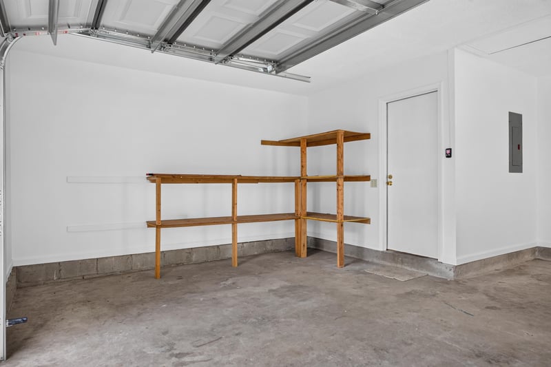 Garage interior with built-in wood shelving at 2829 Blackberry Ave