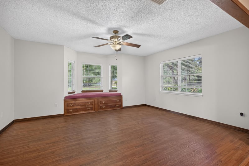 Bonus room with ceiling fan and bay window at 892 Branscomb Rd, Green Cove Springs, FL