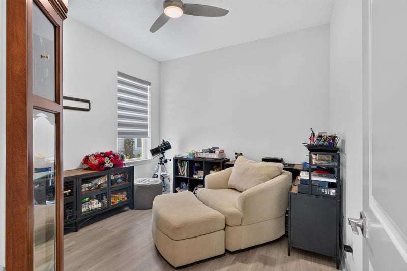 Bedroom set up as an office with seating area at 785 Back Creek Dr, St. Augustine, FL 32092