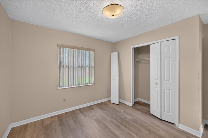 Bedroom with closet and window blinds at 6646 Shiloh Creek Dr