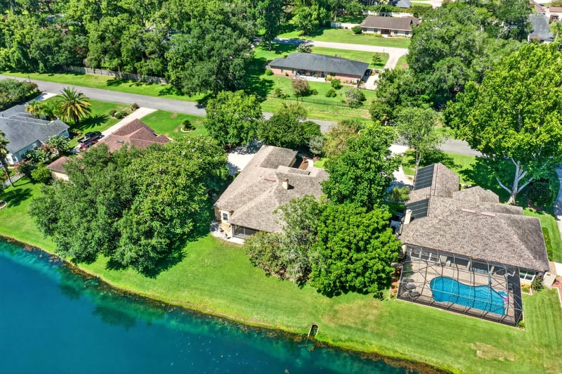 Aerial of the pond with a neighboring pool in Jacksonville, FL