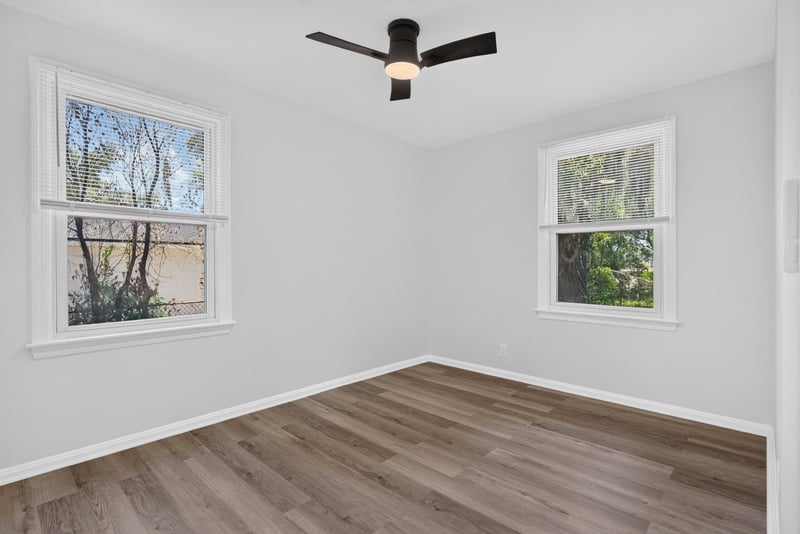 Bedroom with ceiling fan and window at 855 Cornwallis Dr, Jacksonville, FL