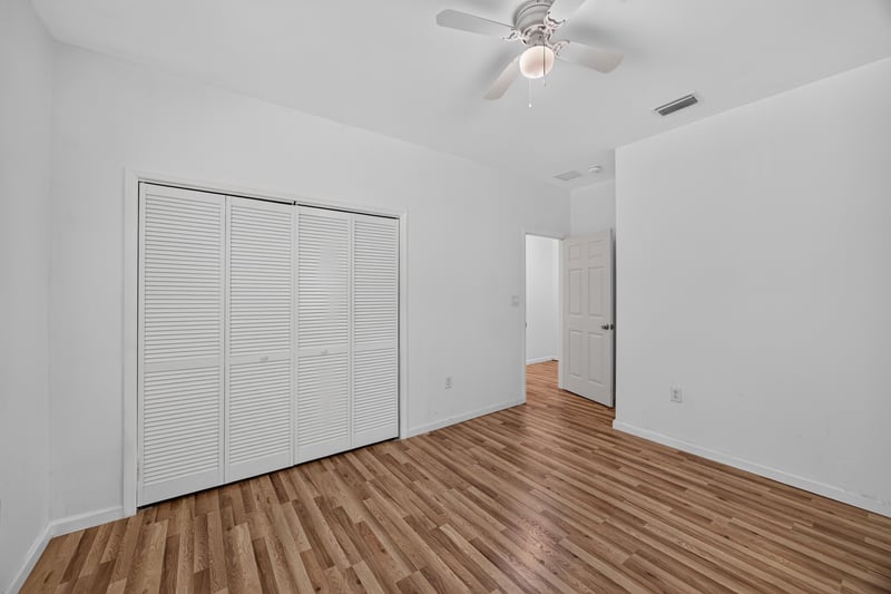 Bedroom with sliding closet doors at 1012 Fruit Cove Rd, Jacksonville, FL 32259
