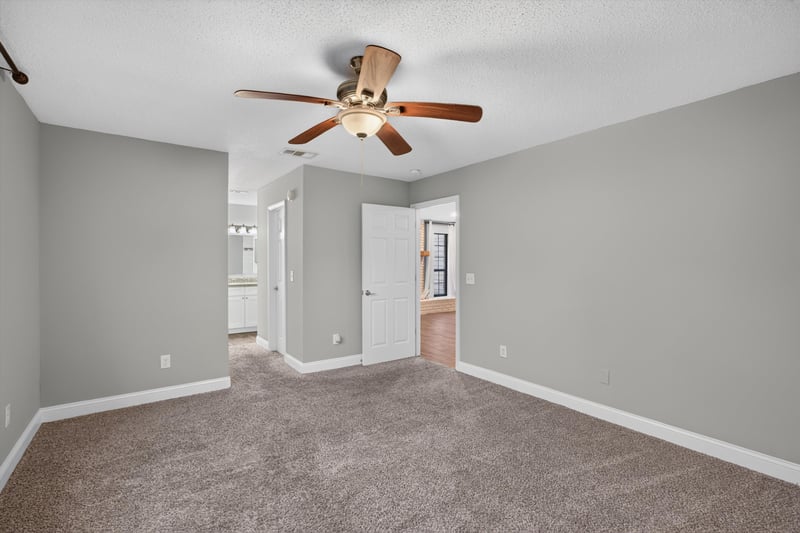 Carpeted bedroom with ceiling fan at 12344 Cormorant Ct, Jacksonville, FL