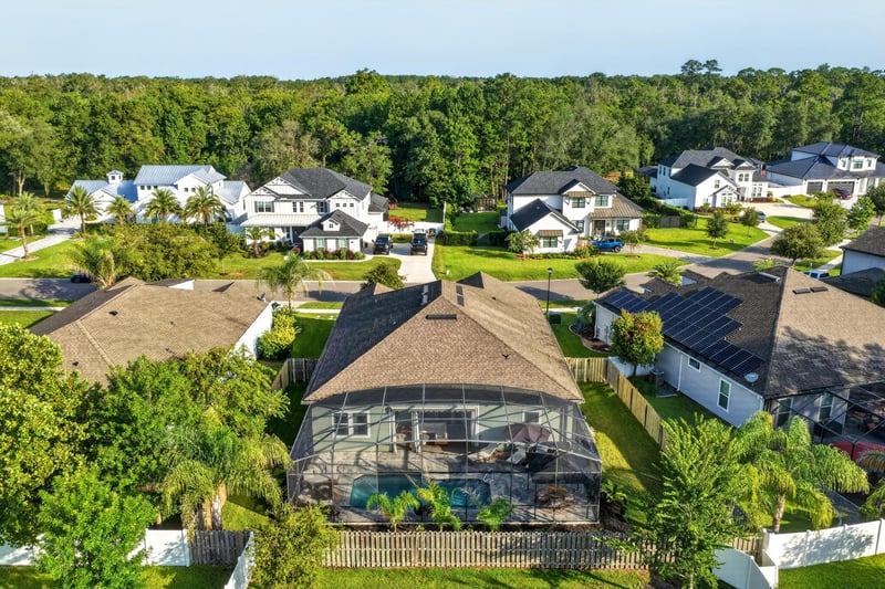 Aerial view of the pool and backyard in the neighborhood at 3328 Southern Oaks Dr, Green Cove Springs, FL 32043