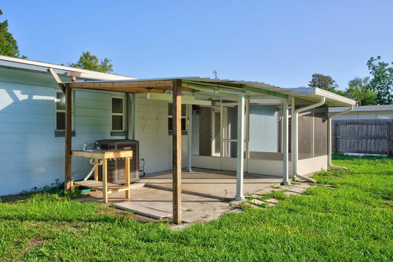 Covered back patio with grill at 442 Ameca Ave, Orange Park, FL 32073
