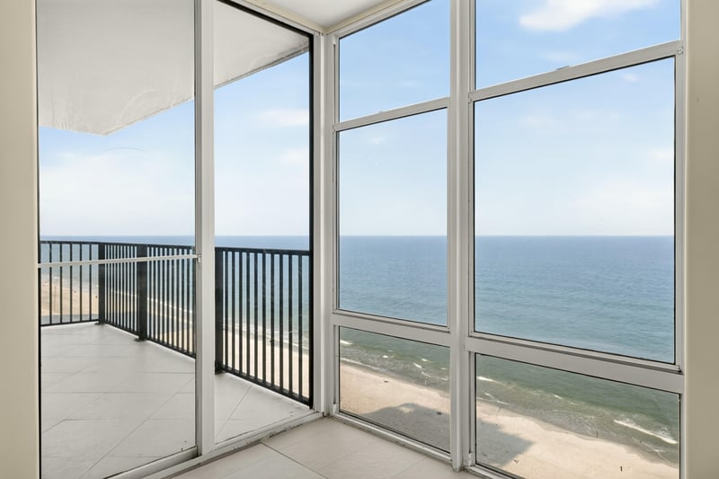 Room with floor-to-ceiling windows and ocean view at 1301 1st St S