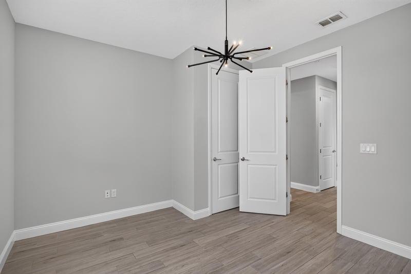 Bedroom with double doors at 91 Tilloo Ct, St. Johns, FL