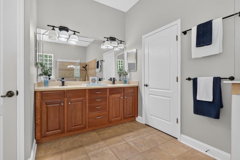 Bathroom with double vanity and wood cabinets at 4109 Eagle Landing Pkwy, Orange Park, FL 32065