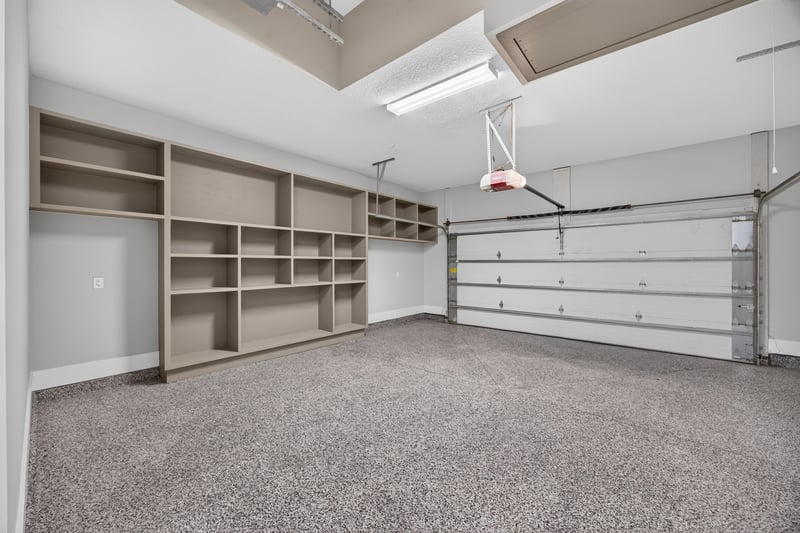 Garage interior with built-in storage shelving at 186 Freshwater Dr