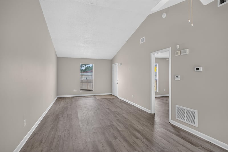 Dining area with wood-look flooring and window at 2717 Trollie Ln, Jacksonville, FL
