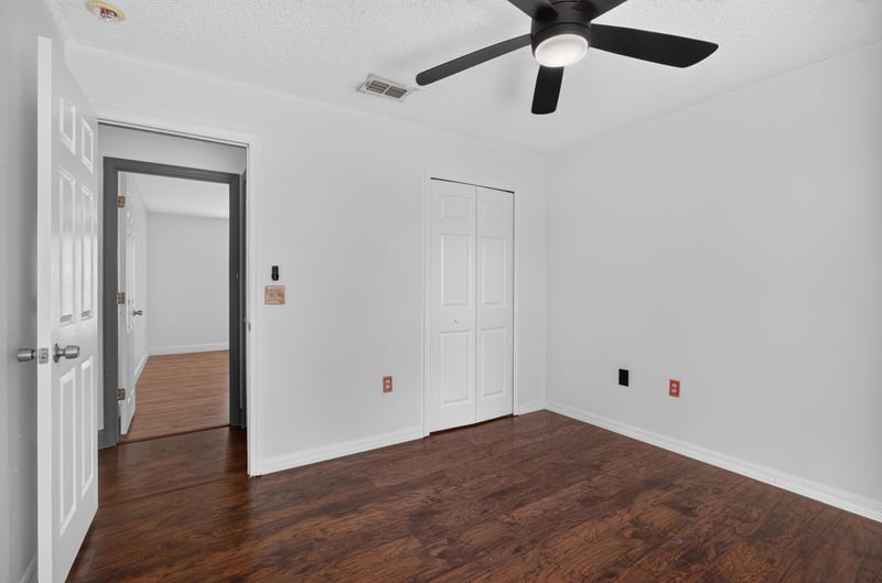 Bedroom with wood floor and door at 3428 Glenn Hollow Ct, Jacksonville, FL 32226