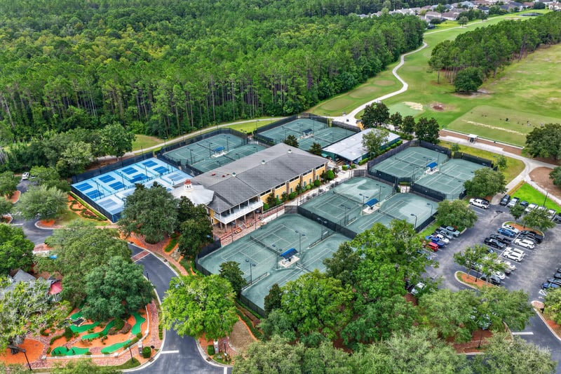 Aerial view of tennis courts and clubhouse in Oakleaf Plantation