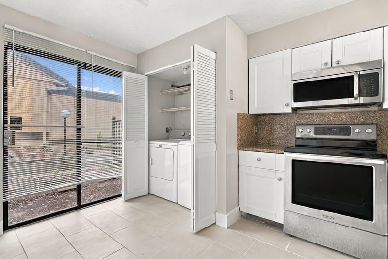 Kitchen with laundry closet nearby at 7703 Las Palmas Way